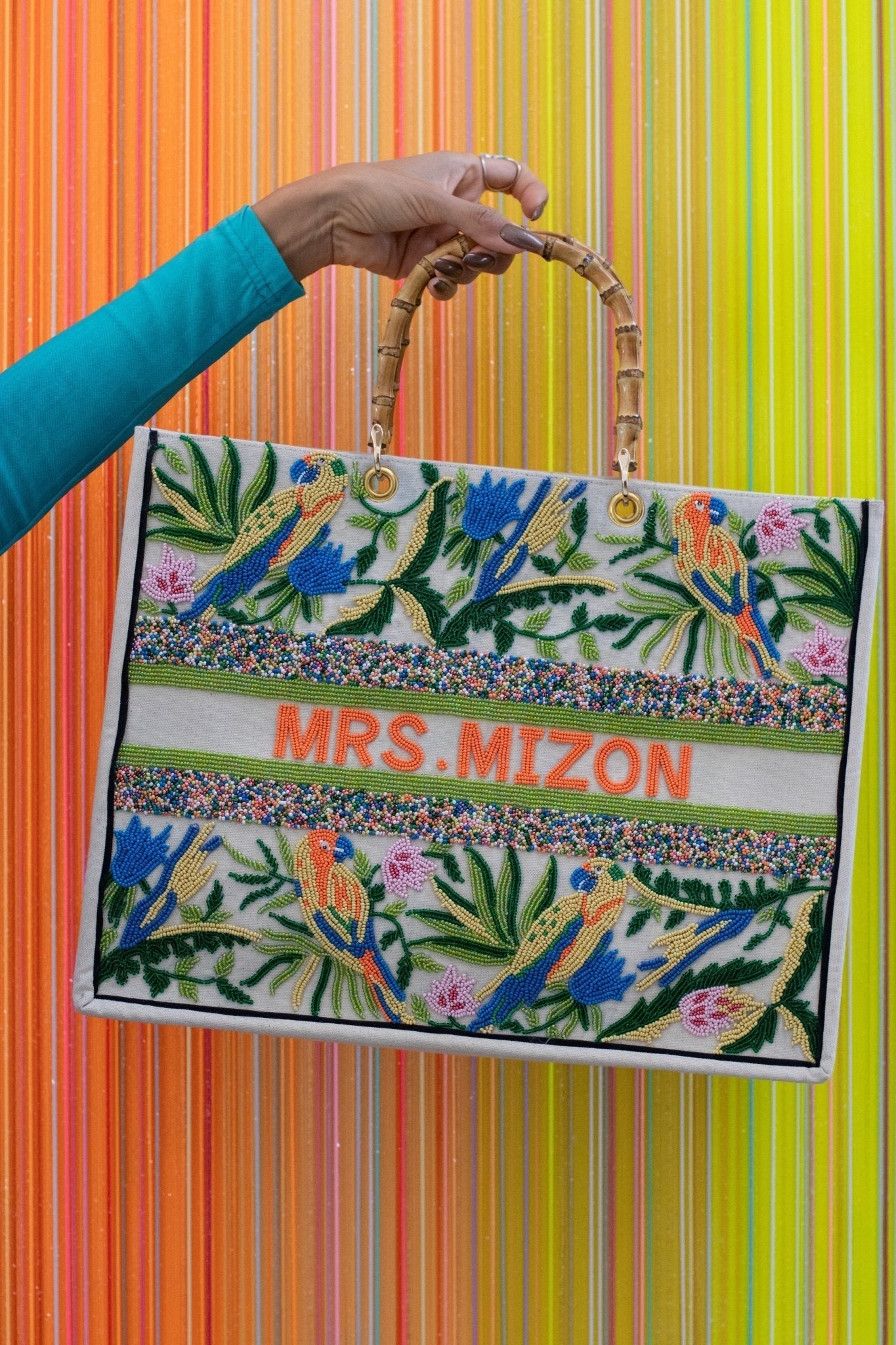 Beaded tote bag with bamboo handles and lovebird design