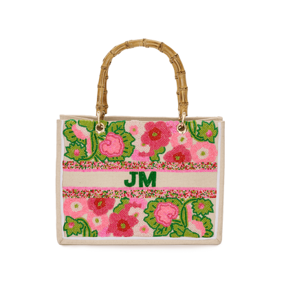 Beaded tote bag with bamboo handles and floral design